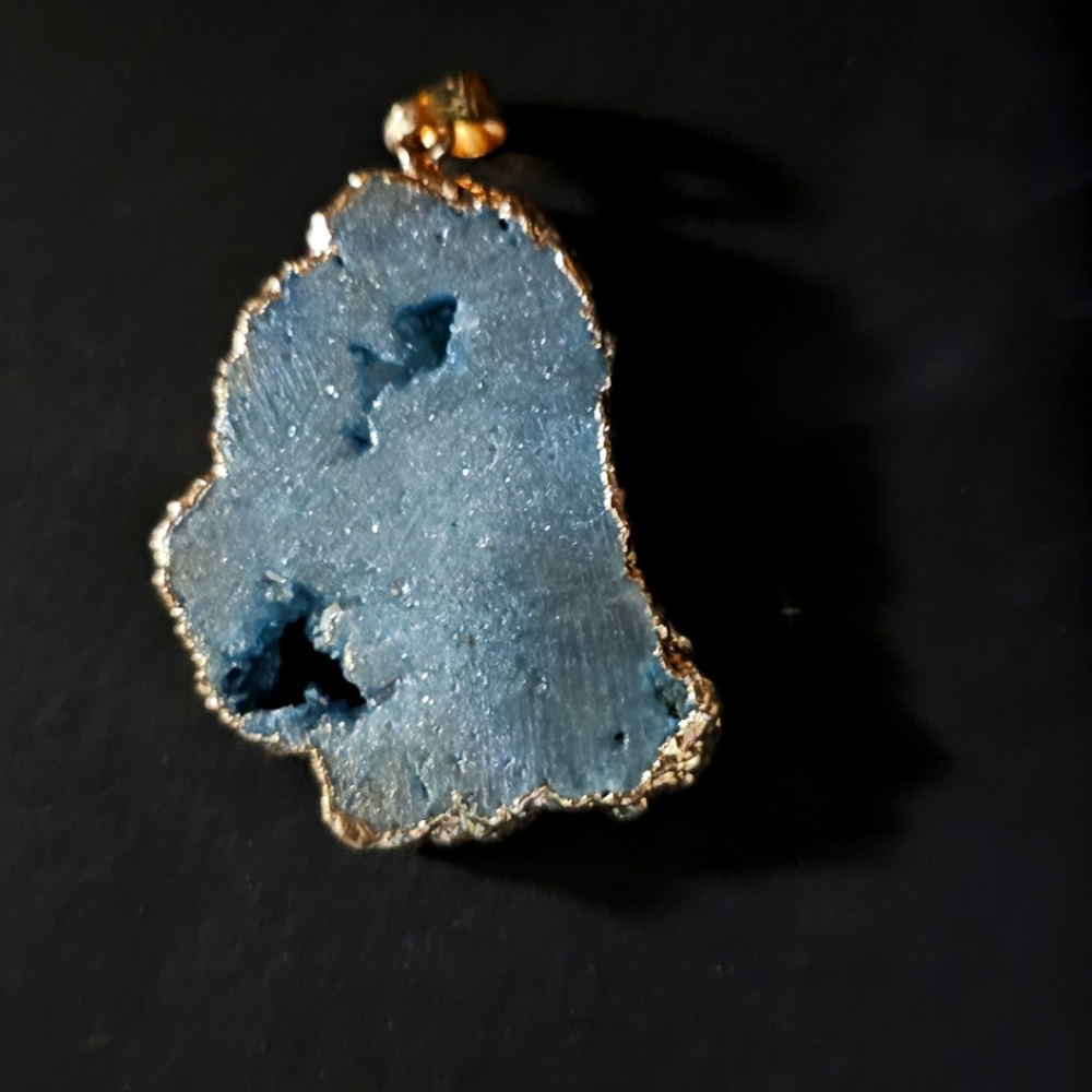 Geode style pendant with gold trim